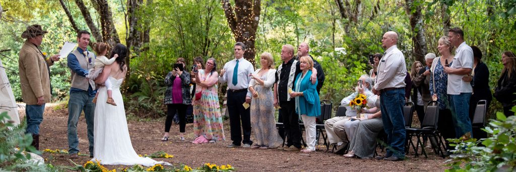 img="bride and groom with family by Eric Wyatt Photography"