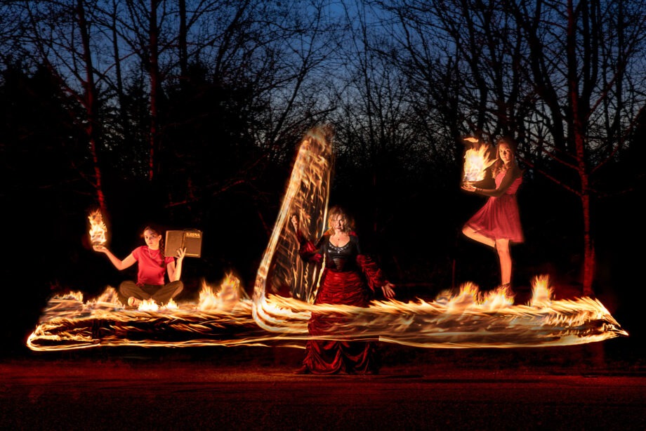 img="mother and daughter photography with fire by Eric Wyatt"