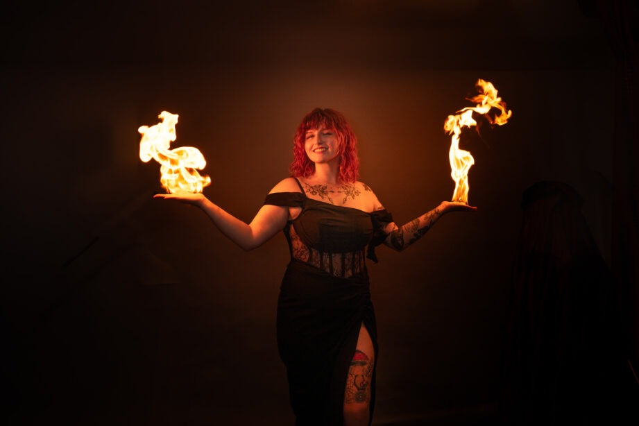 img="woman holding fire by Eric Wyatt photography"