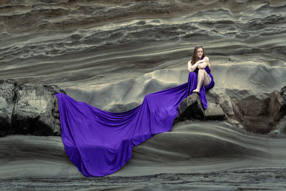 img="woman in flowy dress on rocks by Eric Wyatt Photography"