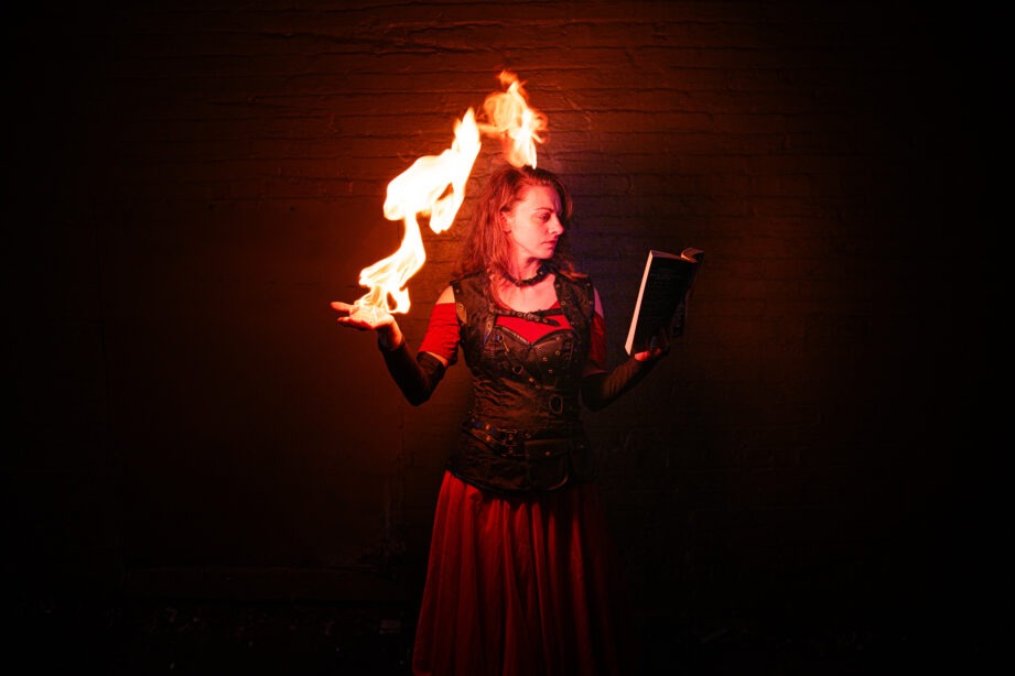 img="woman with sword and fire by Eric Wyatt Photography"