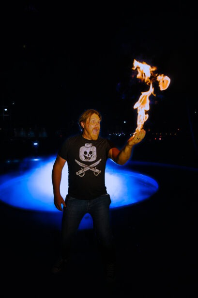 img="man holding fire by Eric Wyatt Photography"